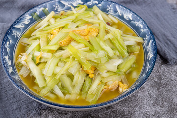 The scrambled eggs with chives on the plate