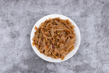 The fried rice noodles on the plate