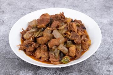 The pickled cabbage and konjac braised duck on the plate