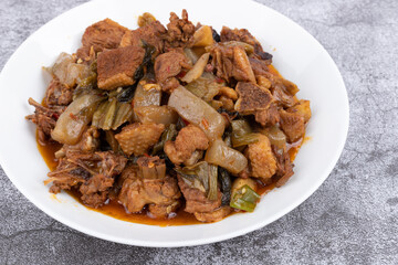 The pickled cabbage and konjac braised duck on the plate