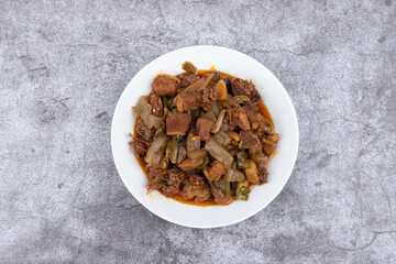 The pickled cabbage and konjac braised duck on the plate