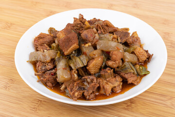 The pickled cabbage and konjac braised duck on the plate