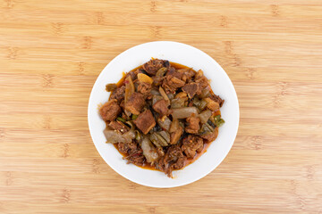 The pickled cabbage and konjac braised duck on the plate