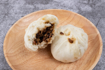 The steamed buns with braised pork filling on the plate