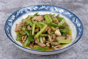 Stir-fried pork with celery on the plate