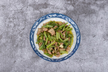 Stir-fried pork with celery on the plate