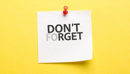 A white rectangular note pinned with a red pushpin to a light yellow surface reads “DON’T FORGET” in bold black text—simple, urgent, and iconic in its visual language of reminders.