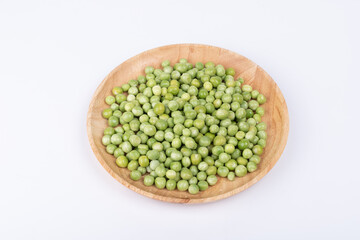 Raw peas on the plate