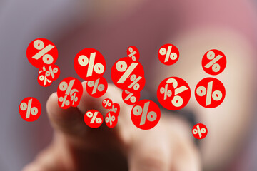 Image of a hand interacting with digital percentage symbols, ideal for discount, sale, finance...