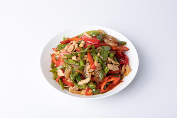 The stir-fried meat with green and red peppers on the plate