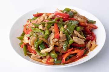 The stir-fried meat with green and red peppers on the plate