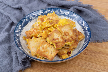 The fried tofu with eggs on the plate