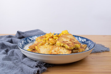The fried tofu with eggs on the plate