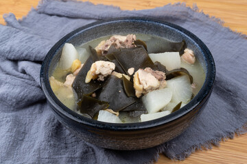 Chicken stewed with kelp and radish in a porcelain bowl
