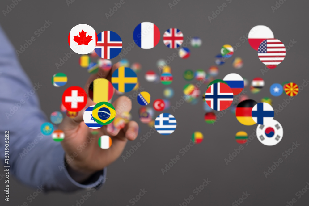 Aufkleber abstract image of a hand interacting with floating flags representing international connections.