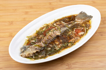 Steamed sea bass bones on the plate