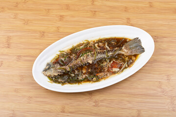 Steamed sea bass bones on the plate