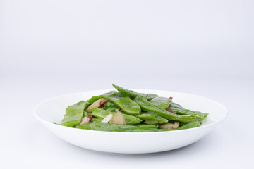 The stir-fried pork with green beans on the plate