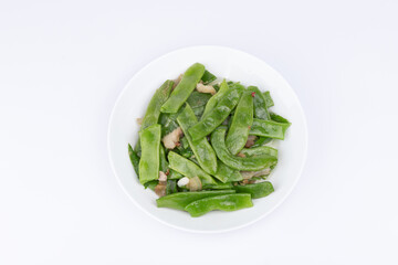 The stir-fried pork with green beans on the plate