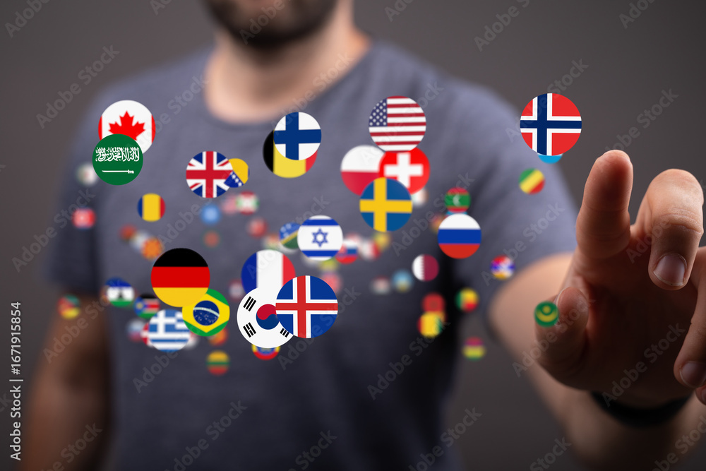 Poster a man interacts with a digital display of world flags, symbolizing global connectivity and internati