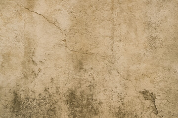 Obraz premium Textured beige wall with cracks and imperfections in surface