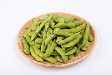 Fresh edamame in a wooden plate