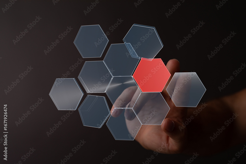Poster abstract image of a hand interacting with a digital hexagon network, highlighting a key element.