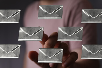 Person interacts with digital emails, showcasing inbox management and email organization.