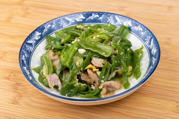 Stir-fried pork with green peppers on the plate