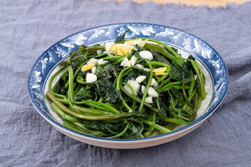 The stir-fried sweet potato leaves on the plate