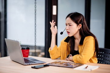 Angry young woman arguing with businessman in casual meeting at café, frustrated over contract, debt, or financial problem indoors.
