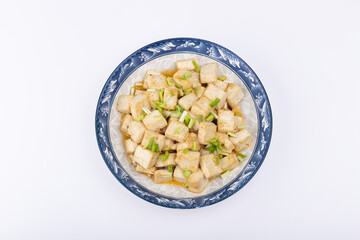 The home-cooked dish stir-fried tofu on the plate