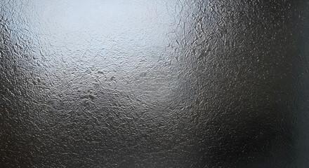 Subtle texture play, a study in light and shadow, where darkness meets illumination to evoke a mysterious yet captivating mood of organic abstract form, its metallic sheen creating intrigue.