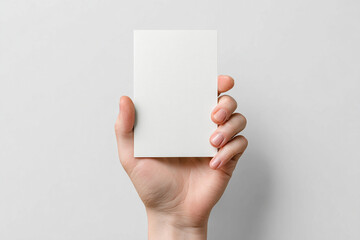 Hand holding blank white card simple design minimalist background