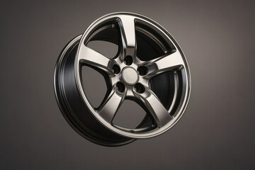 Fototapeta premium Shiny Alloy Wheel Rim on Gray Background
