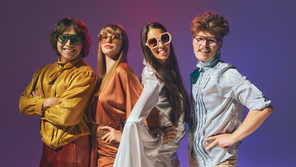 Close up retro disco group in vibrant 70s fashion smiling. Concept of pop culture nostalgia,...