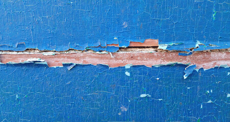 Peeling blue paint texture on wooden surface