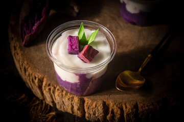 Traditional Thai dessert: mashed purple sweet potatoes topped with coconut milk