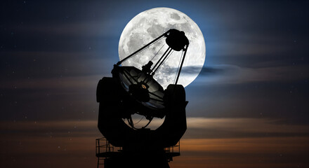 Silhouette of a telescope against a bright full moon in a night sky with some clouds.