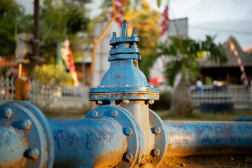 Fototapeta premium water pipe connections made of iron. Drilled well pipes used for irrigation in city parks.