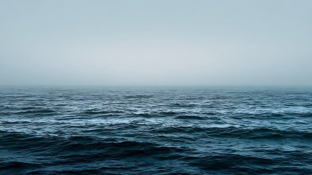 serene ocean horizon with blue and gray water beneath peaceful sky
