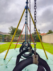 Public children's playground park on a cloudy day