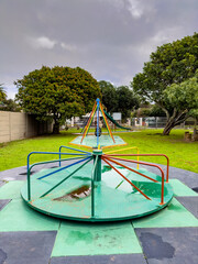 Public children's playground park on a cloudy day