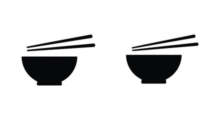 Two black bowls with chopsticks on a white background