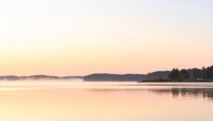 Fototapeta premium Lake in Soft Sunrise Haze with Reflections Surrounded by Trees and a Calm Surface in Tranquil Morning
