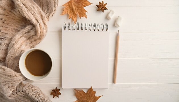 Cozy Autumn Workspace: Blank Notepad Coffee and Knit Sweater Flatlay