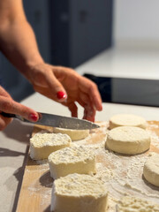 Cutting dough for cottage cheese pancakes, a culinary moment