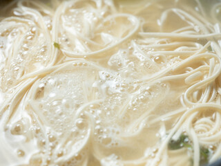 Kalguksu noodles in boiling water