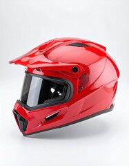 A shiny red full-face helmet with a dark visor and a peak, presented against a plain white background.