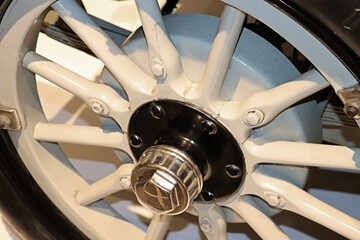 Wooden spoked wheel with retro car rim